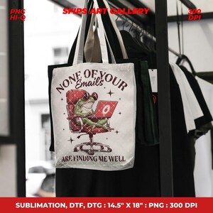 May include: A white tote bag with a humorous frog design. The frog is wearing sunglasses and using a laptop while seated in a red chair. Text on the bag reads "NONE OF YOUR EMAILS ARE FINDING ME WELL". The bag measures 14.5" x 18".