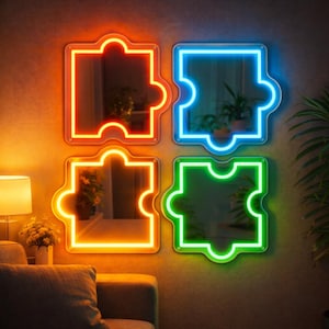 May include: Four puzzle-shaped mirrors with neon-colored frames in orange, blue, green, and yellow. The mirrors are mounted on a neutral-colored wall, reflecting the room's interior. The design is modern and decorative.