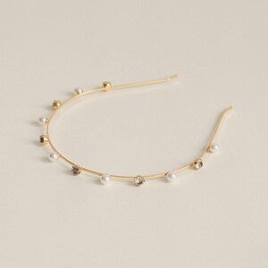 Haarreif aus Metall mit Strass & Kunststoffperle