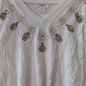 Bedazzled 80s perfume bottle sweatshirt