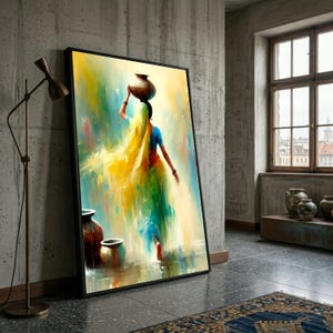 May include: A framed art print showing a woman with a pot on her head, painted with vivid yellow, green, and blue colours. The artwork is propped against a concrete wall, with a floor lamp and pottery visible.