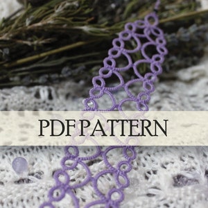 May include: A purple crochet lace pattern with the text "PDF PATTERN" on a white background. The lace is surrounded by white lace fabric, a bundle of dried lavender, and a ball of purple yarn.