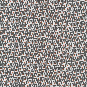 May include: A fabric featuring a repeating geometric pattern of white U-shaped forms and small orange circles set against a dark charcoal gray background. The design consists of interlocking shapes that create a dense, uniform, and structured visual texture.
