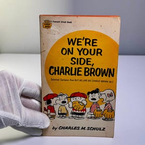 1967 &quot;We&#39;re On Your Side, Charlie Brown&quot; by Charles M. Schulz - Paperback Book