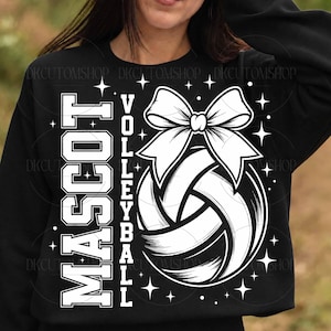 May include: A black long-sleeve sweatshirt featuring a white graphic print. The design includes the text "MASCOT VOLLEYBALL" in a bold block font, a volleyball illustration topped with a large bow, and several small four-pointed star accents.