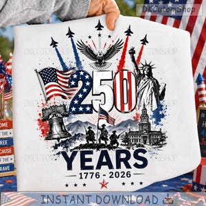 May include: A white fabric item featuring a patriotic graphic with the text 250 YEARS 1776-2026. The design includes a bald eagle, the Statue of Liberty, the Liberty Bell, soldiers, fighter jets, and American flags in red, white, and blue colors.