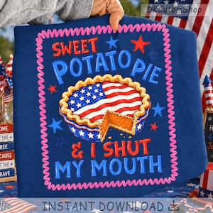May include: A navy blue graphic featuring a sweet potato pie with an American flag design. The text reads "SWEET POTATO PIE & I SHUT MY MOUTH" in red and blue. Pink stars and a pink border frame the design, perfect for Independence Day.