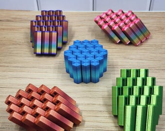 Juguete antiestrés hexagonal: hexágono deslizante entrelazado, inspirado en la Calzada del Gigante y las formaciones cristalinas.