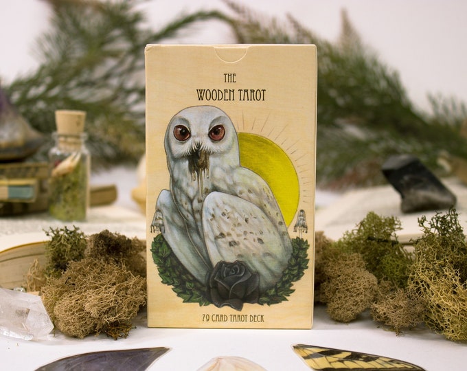 Handcrafted wooden tarot cards with intricate designs