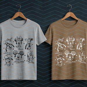 May include: Two t-shirts, one light gray and one brown, each displaying a black and white sketch of Disney characters. The designs include Mickey Mouse, Minnie Mouse, Goofy, Pluto, and Donald Duck, with their names and signatures.