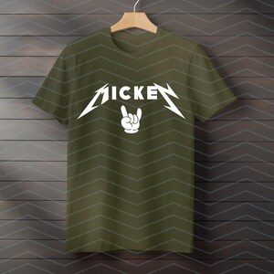 May include: Olive green t-shirt with the word "MICKE" in a stylized white font, with a hand gesture below. The design is reminiscent of a rock band logo. The shirt is hanging on a wooden hanger.