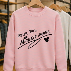 May include: A light pink long-sleeve crewneck sweatshirt featuring black text that reads Your Pal, Mickey Mouse, with a small black silhouette of Mickey Mouse ears positioned to the right of the signature-style lettering on the front.