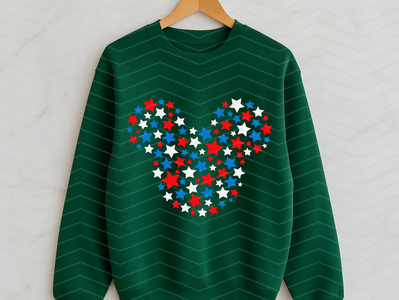 May include: A dark green long-sleeve sweatshirt featuring a subtle chevron pattern and a central graphic composed of numerous small red, white, and blue stars arranged to form the distinct silhouette of a mouse head with two round ears.