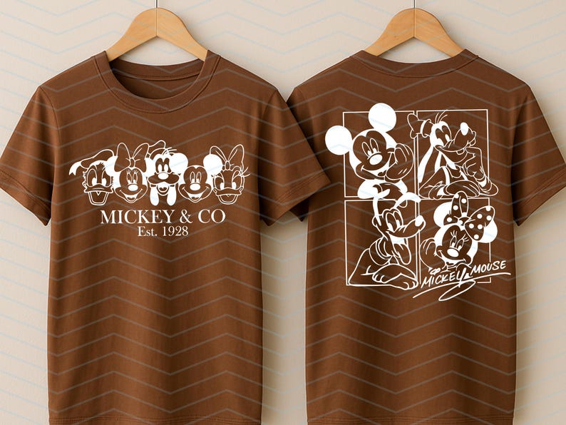 May include: A brown short-sleeved t-shirt featuring white graphic prints. The front displays five cartoon character faces with the text MICKEY & CO Est. 1928. The back shows a four-panel grid of characters with the text MICKEY MOUSE.
