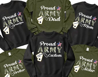 May include: Several black and olive green sweatshirts with the text "Proud Army" and titles such as "Dad", "Mom", "Grandpa", "Brother", "Sister", and "Custom". Each design features a camouflage pattern and a star in red, white, and blue.