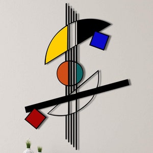Puede incluir: Arte de pared abstracto con formas geométricas en negro, amarillo, rojo, azul y verde. Las formas están dispuestas en un diseño moderno y asimétrico.