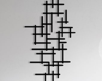 Arte mural geométrico en metal: escultura minimalista de formas y líneas abstractas.
