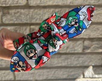 スーパーマリオの結び目付きヘッドバンド：壮大な世界観にインスパイアされたデザイン