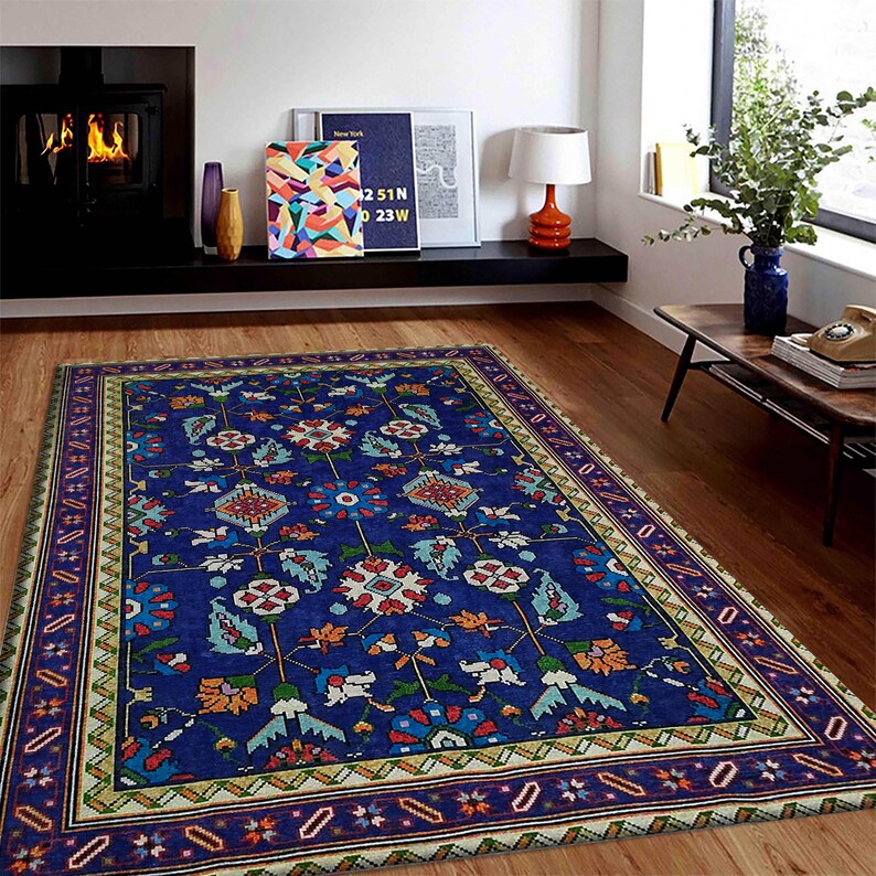 May include: A blue rug with a floral pattern and a beige border. The rug has a traditional design with intricate details.