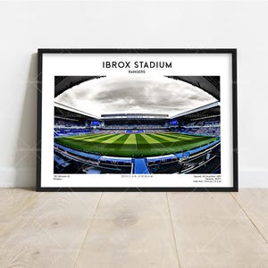 May include: A white ceramic mug with a black handle and the text "But First, Coffee" in a handwritten style. The mug is on a white surface. The mug is approximately 4 inches tall.