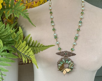 Green brooch and butterfly necklace