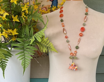 Orange tin flower brooch necklace