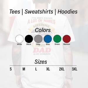 May include: White t-shirt with the text "I'VE BEEN CALLED A LOT OF NAMES IN MY LIFETIME BUT DAD IS MY FAVORITE". Available in white, black, grey, blue, green, and maroon. Sizes range from S to 3XL. Tees, sweatshirts, and hoodies.