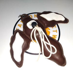 Magpie shaped leather lure.