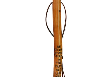 May include: A wooden walking stick with a leather strap and the inscription "Be Watchful, Stand Firm in the Faith, Act Like Men, Be Strong".