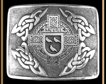 May include: A rectangular silver-toned kilt buckle featuring an intricate Celtic interlace pattern surrounding a central cross and a shield crest with three birds. The text "MC GILL" is engraved above the shield, and "INTERLACE KILT BUCKLE BUC3" appears at the top.