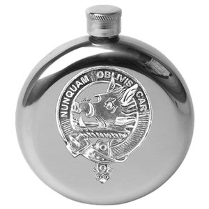 May include: A silver stainless steel hip flask with a silver embossed crest featuring a boar's head and the text "NUNQUAM OBLIVISCAR".
