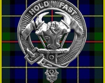 May include: A silver-colored clan crest with a bull's head in the center. The crest is surrounded by a circle with the words "Hold Fast" inscribed around it. The crest is on a tartan background.