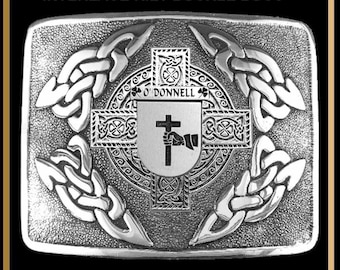 May include: Silver kilt buckle with a Celtic knot design and a shield with the text "O'Donnell" and a cross.