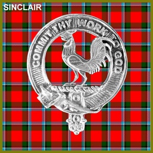May include: A silver metal clan crest with a rooster design and the text "Commit thy work to God" around the edge. The crest is on a red, green, and blue plaid background.