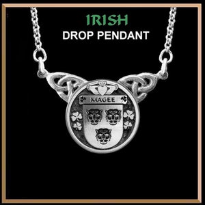 May include: Silver Irish drop pendant necklace with a Celtic knot design and a round pendant featuring the Magee family crest with three lion heads and shamrocks. The pendant also includes the text "Magee" and a shamrock on either side of the text.