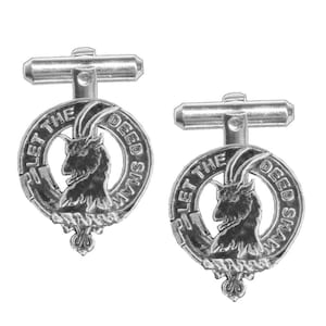 May include: Silver cufflinks with a circular design featuring a goat head and the text "Let the Deid Shaw His Deed".