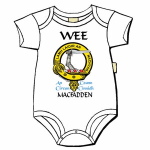 May include: White baby onesie with a yellow and red clan crest and the text "WEE", "LAMH LAIDIR AN NACHTAR", "An Círean", "Ceann Cinnídh", and "MACFADDEN".