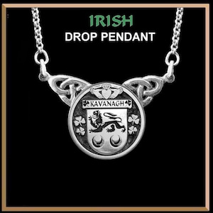 May include: Silver Irish drop pendant necklace with a Celtic knot design. The pendant features a coat of arms with the name "Kavanagh" and a lion crest.