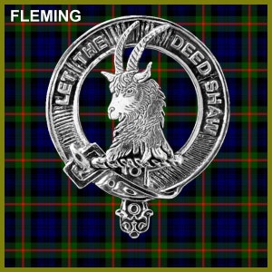 May include: A silver clan crest featuring a goat's head with the text "Let the Deed Shaw" around the outside. The crest is displayed against a blue, green and red tartan background.
