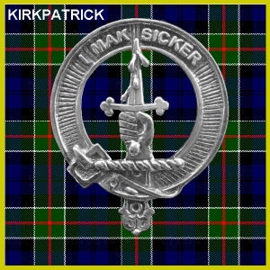 May include: A silver metal clan crest with the text "I MAK SICKER" around the outside. The crest features a hand holding a sword with a cross on the hilt. The crest is on a blue, green, red, and yellow tartan background.