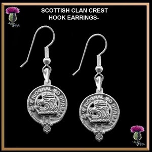 May include: Silver hook earrings with a silver clan crest charm. The charm features a wolf's head with a crown and the text "S RIOGHAL MO DHREIX".