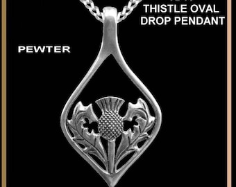 May include: A silver pewter pendant necklace featuring a thistle design. The pendant is shaped like a teardrop and has a detailed design of a thistle flower with leaves. The necklace is labeled "TD10 Thistle Oval Drop Pendant".