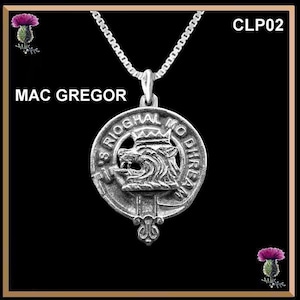 May include: Silver pendant necklace with a silver chain. The pendant features a silver crest with a lion's head and the text "S Rioghal Mo Dhire", which is Gaelic for "The Royal One, Gentle", and the text "Mac Gregor".