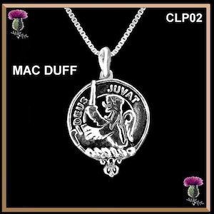 May include: Silver pendant necklace with a round silver charm featuring a lion holding a sword. The charm has the words "Deus Juvat" inscribed around the edge. The necklace is on a silver chain.