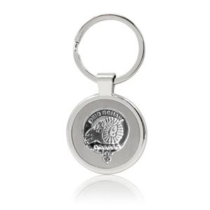 May include: Silver keychain with a round metal charm featuring a silver ram's head crest with the text "DEID SCHAW" around the crest.