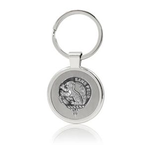 May include: Silver keychain with a round metal charm featuring a Scottish clan crest with a squirrel and the text "SANS PEUR".
