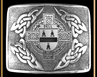 May include: Silver kilt buckle with an interlace design and a crest featuring the name "BELL" and three bells.