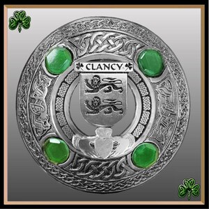May include: Silver Clan Crest Kilt Pin with green gemstones and the text "CLANCY" in the centre.