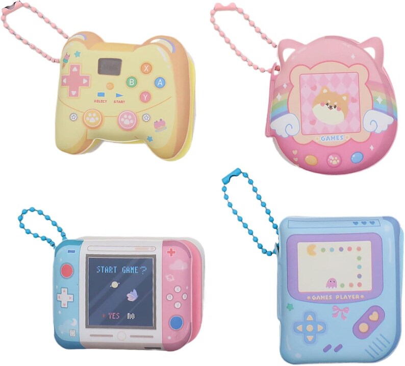 May include: Four colorful keychain-style handheld game consoles. The first is yellow and shaped like a game controller. The second is pink with a heart-shaped screen and the text "GAMES". The third is white and pink with a screen that says "START GAME?" and the text "YES NO". The fourth is blue with a screen that says "GAME PLAYERS".