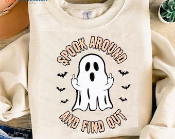 May include: A white ghost with a surprised expression is giving the middle finger. The ghost is surrounded by bats and the text "Spook Around And Find Out".